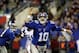 Oct 21, 2013; East Rutherford, NJ, USA; New York Giants quarterback Eli Manning (10) reaches to knock down a pass that was batted back at him during the first half against the Minnesota Vikings at Metlife Stadium. Mandatory Credit: Chris Faytok/THE STAR-