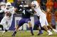 FORT WORTH, TX - OCTOBER 26: Casey Pachall #4 of the TCU Horned Frogs is sacked by Jackson Jeffcoat #44 of the Texas Longhorns as Chris Whaley #96 of the Texas Longhorns assists in the third quarter at Amon G. Carter Stadium on October 26, 2013 in Fort W