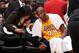 LOS ANGELES, CA - DECEMBER 10: Kobe Bryant #24 of the Los Angeles Lakers speaks to physical therapist Judy Seto during a game against the Phoenix Suns at Staples Center on December 10, 2013 in Los Angeles, California. NOTE TO USER: User expressly acknowle