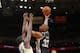 OAKLAND, CA - DECEMBER 19: Boris Diaw #33 of the San Antonio Spurs shoots against Draymond Green #23 of the Golden State Warriors on December 19, 2013 at Oracle Arena in Oakland, California. NOTE TO USER: User expressly acknowledges and agrees that, by do