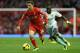 LIVERPOOL, ENGLAND - DECEMBER 07: Joe Allen of Liverpool competes with Mohamed Diame of West Ham United during the Barclays Premier League match between Liverpool and West Ham United at Anfield on December 7, 2013 in Liverpool, England. (Photo by Clive