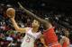 HOUSTON, TX - DECEMBER 18: Chandler Parsons #25 of the Houston Rockets drives with the ball against Luol Deng #9 of the Chicago Bulls during the game at Toyota Center on December 18, 2013 in Houston, Texas. NOTE TO USER: User expressly acknowledges and a