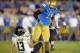 Nov 2, 2013; Pasadena, CA, USA; UCLA Bruins linebacker Anthony Barr (11) is called for a roughing the passer penalty after a hit on Colorado Buffaloes quarterback Sefo Liufau (13) at Rose Bowl. UCLA defeated Colorado 45-23. Mandatory Credit: Kirby Lee-USA