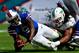 MIAMI GARDENS, FL - OCTOBER 20: Quarterback Thad Lewis #9 of the Buffalo Bills is tackled by Philip Wheeler #52 of the Miami Dolphins at Sun Life Stadium on October 20, 2013 in Miami Gardens, Florida. (Photo by Chris Trotman/Getty Images)