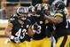 PITTSBURGH, PA - DECEMBER 08: Troy Polamalu #43 of the Pittsburgh Steelers celebrates his interception and touchdown in the third quarter with Jason Worilds #93 and LaMarr Woodley #56 against the Miami Dolphins at Heinz Field on December 8, 2013 in Pitts