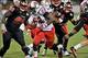 Oct 15, 2013; Bowling Green, KY, USA; Louisiana-Lafayette Ragin Cajuns running back Elijah McGuire (22) rushes against Western Kentucky Hilltoppers defensive lineman Devante Terrell (98) during the second half at Houchens Industries-L.T. Smith Stadium. Lo