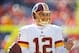 Oct 27, 2013; Denver, CO, USA; Washington Redskins quarterback Kirk Cousins (12) before the game against the Denver Broncos at Sports Authority Field at Mile High. Mandatory Credit: Chris Humphreys-USA TODAY Sports
