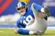 EAST RUTHERFORD, NJ - DECEMBER 15: Quarterback Eli Manning #10 lays on the ground in the 1st half against the Seattle Seahawks at MetLife Stadium on December 15, 2013 in East Rutherford, New Jersey. (Photo by Ron Antonelli/Getty Images)