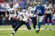 EAST RUTHERFORD, NJ - DECEMBER 15: Quarterback Russell Wilson #3 of the Seattle Seahawks runs with the ball in the 1st half against the New York Giants at MetLife Stadium on December 15, 2013 in East Rutherford, New Jersey. (Photo by Ron Antonelli/Getty I