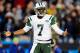 CHARLOTTE, NC - DECEMBER 15: Geno Smith #7 of the New York Jets reacts after being called for a delay of game penalty during a loss to the Carolina Panthers at Bank of America Stadium on December 15, 2013 in Charlotte, North Carolina. The Panthers won 30