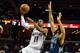 Dec 15, 2013; Memphis, TN, USA; Memphis Grizzlies point guard Mike Conley (11) drives to the basket against Minnesota Timberwolves point guard Ricky Rubio (9) during the first quarter at FedExForum. Mandatory Credit: Justin Ford-USA TODAY Sports