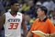 Nov 28, 2013; Lake Buena Vista, FL, USA; Oklahoma State Cowboys guard Marcus Smart (33) talks to head coach Travis Ford after he was called for a technical foul in the second half of their Old Spice Classic game against the Purdue Boilermakers at HP Field