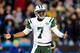 CHARLOTTE, NC - DECEMBER 15: Geno Smith #7 of the New York Jets reacts after being called for a delay of game penalty during a loss to the Carolina Panthers at Bank of America Stadium on December 15, 2013 in Charlotte, North Carolina. The Panthers won 30