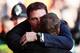 LIVERPOOL, ENGLAND - DECEMBER 21: Cardiff City manager Malky Mackay (L) is embraced by Liverpool manager Brendan Rogers (R) before the Barclays Premier League match between Liverpool and Cardiff City at Anfield on December 21, 2013 in Liverpool, England.