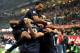 MILAN, ITALY - OCTOBER 26: Rodrigo Palacio of FC Inter Milan is surrounded in congratulation by team-mates after scoring their team's second goal during the Serie A match between FC Internazionale Milano and Hellas Verona at Stadio Giuseppe Meazza on Oct