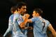 LONDON, ENGLAND - DECEMBER 21: Jesus Navas of Manchester City celebrates scoring their third goal during the Barclays Premier League match between Fulham and Manchester City at Craven Cottage on December 21, 2013 in London, England. (Photo by Clive Rose