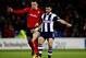 CARDIFF, WALES - DECEMBER 14: Shane Long of West Brom and Jordan Mutch of Cardiff battle for possesion during the Barclays Premier League match between Cardiff City and West Bromwich Albion at Cardiff City Stadium on December 14, 2013 in Cardiff, Wales.