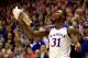 LAWRENCE, KS - DECEMBER 21: Jamari Traylor #31 of the Kansas Jayhawks reacts from the bench after the Jayhawks scored during the game against the Georgetown Hoyas at Allen Fieldhouse on December 21, 2013 in Lawrence, Kansas. (Photo by Jamie Squire/Getty