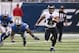 DETROIT, MI - DECEMBER 16: Ray Rice #27 of the Baltimore Ravens runs for a first down as C. J. Mosley #99 of the Detroit Lions attempts makes the tackle during the second quarter of the game against the Detroit Lions at Ford Field on December 16, 2013 in