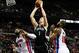 Dec 13, 2013; Auburn Hills, MI, USA; Brooklyn Nets power forward Mason Plumlee (1) attempts a shot in between Detroit Pistons center Andre Drummond (0) and power forward Greg Monroe (10) during the second quarter at The Palace of Auburn Hills. Pistons bea