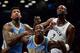 Dec 3, 2013; Brooklyn, NY, USA; Denver Nuggets small forward Wilson Chandler (21) and power forward J.J. Hickson (7) box out Brooklyn Nets power forward Kevin Garnett (2) during a free throw attempt during the second half at Barclays Center. The Nuggets w