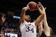 Dec 21, 2013; Lawrence, KS, USA; Kansas Jayhawks forward Perry Ellis (34) is fouled by Georgetown Hoyas forward Nate Lubick (34) while shooting during the first half at Allen Fieldhouse. Mandatory Credit: Denny Medley-USA TODAY Sports
