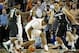 Dec 21, 2013; Austin, TX, USA; Texas Longhorns center Cameron Ridley (55) controls a loose ball against Michigan State Spartans guard Keith Appling (11) and forward Alex Gauna (2) during the first half at the Frank Erwin Special Events Center. Mandatory C