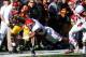 LAS VEGAS, NV - DECEMBER 21: Nelson Agholor #15 of the USC Trojans is tackled by Dalen Jones #5 of the Fresno State Bulldogs during the Royal Purple Las Vegas Bowl at Sam Boyd Stadium on December 21, 2013 in Las Vegas, Nevada. (Photo by Ethan Miller/Get