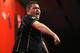 LONDON, ENGLAND - DECEMBER 20: Michael Smith of England celebrates after winning his second round match against Phil Taylor of England during the Ladbrokes.com World Darts Championship on Day Eight at Alexandra Palace on December 20, 2013 in London, Engla