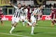 LIVORNO, ITALY - DECEMBER 21: Thomas Heurtaux (R) of Udinese Calcio celebrates after scoring a goal during the Serie A match between AS Livorno Calcio and Udinese Calcio at Stadio Armando Picchi on December 21, 2013 in Livorno, Italy. (Photo by Gabriele