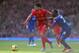 LIVERPOOL, ENGLAND - DECEMBER 21: Luis Suarez of Liverpool attempts to move away from Kevin Theophile of Cardiff City during the Barclays Premier League match between Liverpool and Cardiff City at Anfield at Anfield on December 21, 2013 in Liverpool, Eng