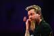 LONDON, ENGLAND - DECEMBER 17: Simon Whitlock of Australia prepares to throw during his first round match against Ross Smith of Great Britain during day five of the 2014 Ladbrokes.com World Darts Championship at Alexandra Palace on December 17, 2013 in L
