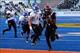 Dec 21, 2013; Boise, ID, USA; San Diego State Aztecs running back Adam Muema (4) runs past Buffalo Bulls linebacker Jake Stockman (9) during the first half of the Idaho Potato Bowl at Bronco Stadium. Mandatory Credit: Brian Losness-USA TODAY Sports