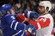 TORONTO, ON - DECEMBER 21: Dion Phaneuf #3 of the Toronto Maple Leafs battles with Todd Bertuzzi #44 of the Detroit Red Wings during NHL game action December 21, 2013 at the Air Canada Centre in Toronto, Ontario, Canada. (Photo by Graig Abel/NHLI via Get