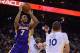 December 21, 2013; Oakland, CA, USA; Los Angeles Lakers small forward Xavier Henry (7) shoots the ball against Golden State Warriors small forward Andre Iguodala (9, center) and power forward David Lee (10) during the second quarter at Oracle Arena. Manda
