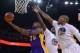 December 21, 2013; Oakland, CA, USA; Los Angeles Lakers shooting guard Jodie Meeks (20) drives to the basket against Golden State Warriors small forward Draymond Green (23) and power forward Marreese Speights (5) during the second quarter at Oracle Arena.
