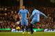 LONDON, ENGLAND - DECEMBER 21: Yaya Toure of Manchester City scores the first goal from a freekick during the Barclays Premier League match between Fulham and Manchester City at Craven Cottage on December 21, 2013 in London, England. (Photo by Clive Ros