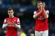MANCHESTER, ENGLAND - DECEMBER 14: Jack Wilshere of Arsenal and Per Mertesacker of Arsenal walk back down towards tunnel during the Barclays Premier League match between Manchester City and Arsenal at Etihad Stadium on December 14, 2013 in Manchester, En