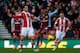 STOKE-ON-TRENT, ENGLAND - DECEMBER 21: Marko Arnautovic of Stoke in action with Fabian Delph (C) of Aston Villa during the Barclays Premier League match between Stoke City and Aston Villa at the Britannia Stadium on December 21, 2013 in Stoke-on-Trent, En
