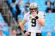 CHARLOTTE, NC - DECEMBER 22: Drew Brees #9 of the New Orleans Saints warms up before a game against the Carolina Panthers at Bank of America Stadium on December 22, 2013 in Charlotte, North Carolina. (Photo by Grant Halverson/Getty Images)