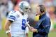 LANDOVER, MD - DECEMBER 22: Head coach Jason Garrett of the Dallas Cowboys talks with Tony Romo #9 during a timeout in the fourth quarter against the Washington Redskins at FedExField on December 22, 2013 in Landover, Maryland. Dallas won the game 24-23.