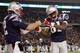 FOXBORO, MA - NOVEMBER 22: Randy Moss #81 and Tom Brady #12 of the New England Patriots celebrate Laurence Maroney's touchdown in the second quarter against the New York Jets on November 22, 2009 at Gillette Stadium in Foxboro, Massachusetts. (Photo by