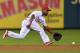 PHILADELPHIA, PA - SEPTEMBER 12: Jimmy Rollins #11 of the Philadelphia Phillies tries to make a play on a ground ball in the third inning against the San Diego Padres at Citizens Bank Park on September 12, 2013 in Philadelphia, Pennsylvania. (Photo by Dr