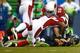 SEATTLE - DECEMBER 22: Russell Wilson #3 of the Seattle Seahawks is sacked by Javier Arenas #35 of the Arizona Cardinals on December 22, 2013 at CenturyLink Field in Seattle, Washington. (Photo by Jonathan Ferrey/Getty Images)