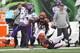CINCINNATI, OH - DECEMBER 22: Cordarrelle Patterson #84 of the Minnesota Vikings runs over Mike Nugent #2 of the Cincinnati Bengals during their game at Paul Brown Stadium on December 22, 2013 in Cincinnati, Ohio. (Photo by John Grieshop/Getty Images)