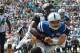 JACKSONVILLE, FL - SEPTEMBER 29: Andrew Luck #12 of the Indianapolis Colts is tackled by John Cyprien #37 and Josh Evans #26 of the Jacksonville Jaguars during a game at EverBank Field on September 29, 2013 in Jacksonville, Florida. (Photo by Mike Ehrm