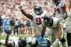 Sep 15, 2013; Houston, TX, USA; Houston Texans nose tackle Earl Mitchell (92) celebrates a tackle for a loss with linebacker Brian Cushing (56) near the goal line in the fourth quarter against Tennessee Titans running back Chris Johnson (28) at Reliant St