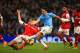 MANCHESTER, ENGLAND - DECEMBER 14: Per Mertesacker of Arsenal tackles Samir Nasri of Manchester City during the Barclays Premier League match between Manchester City and Arsenal at Etihad Stadium on December 14, 2013 in Manchester, England. (Photo by Rich