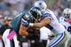 PHILADELPHIA, PA - OCTOBER 20: Tight end Brent Celek #87 of the Philadelphia Eagles makes a first down catch and is tackled by linebacker Sean Lee #50 of the Dallas Cowboys in the fourth quarter during a game at Lincoln Financial Field on October 20, 2013