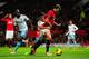 MANCHESTER, ENGLAND - DECEMBER 21: Jonny Evans of Manchester United competes with James Tomkins of West Ham United during the Barclays Premier League match between Manchester United and West Ham United at Old Trafford on December 21, 2013 in Manchester,